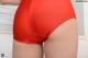 A close up of a woman's butt in a red panties.